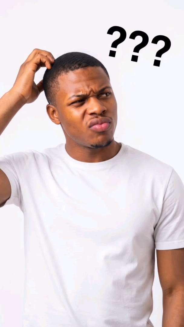 A confused man scratching his head, with question marks above him.